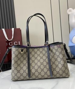 Gucci The GG shopping bag, with its distinctive GG pattern and striped ribbon, is a classic m5765nfw